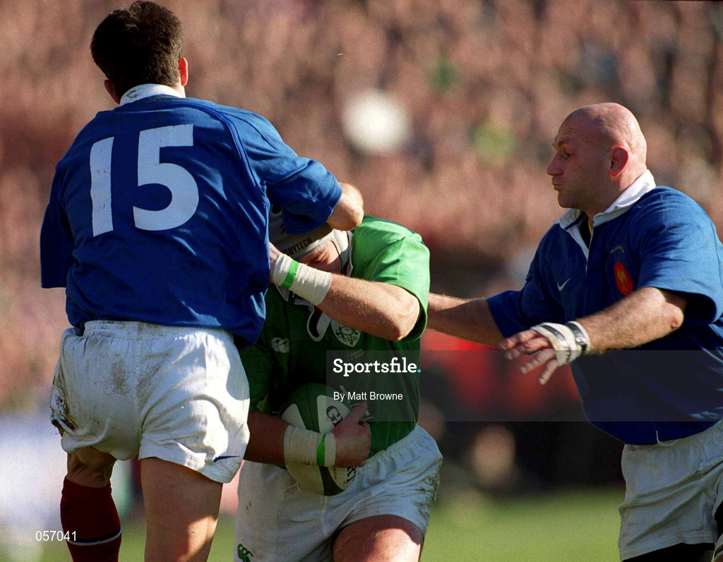 17 February 2001; Ireland's Alan Quinlan is tackled by Xavier Garbajosa, 15, and Christophe Moni of France during the Lloyds TSB Six Nations Rugby Championship match between Ireland and France at Lansdowne Road in Dublin. Photo by Matt Browne/Sportsfile