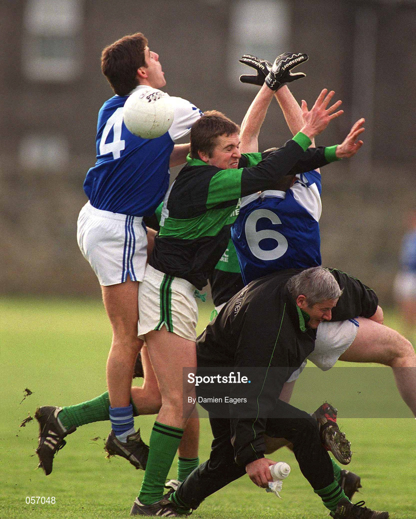 18 February 2001; Alan Cronin of Nemo Rangers competes for the ball with Niall English and Ken Walker of O'Hanrahan's as a Nemo Rangers official inadvertantly gets caught up in the action during the AIB All-Ireland Senior Club Football Championship Semi-Final match between Nemo Rangers and O'Hanrahan's at the Clonmel Sportsfield in Clonmel, Tipperayr. Photo by Damien Eagers/Sportsfile