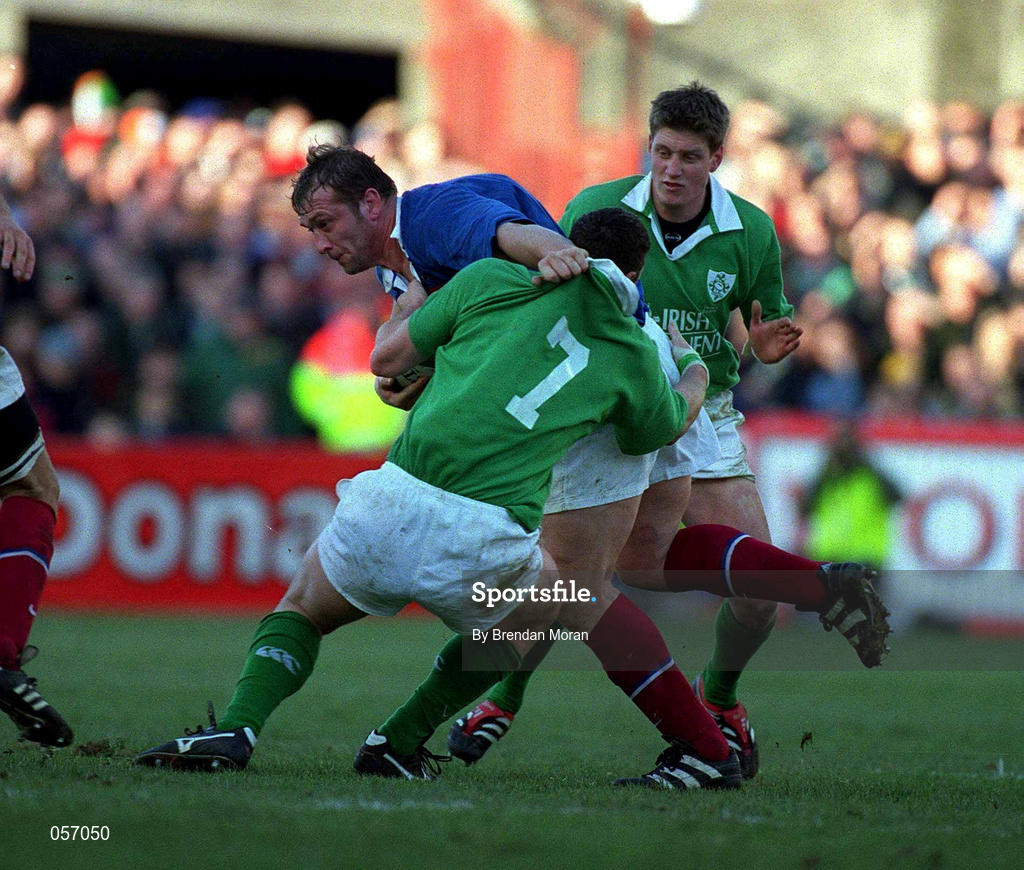 17 February 2001; Olivier Magne of France is tackled by Ireland's David Wallace with the support of team-mate Ronan O'Gara, right, during the Lloyds TSB Six Nations Rugby Championship match between Ireland and France at Lansdowne Road in Dublin. Photo by Brendan Moran/Sportsfile