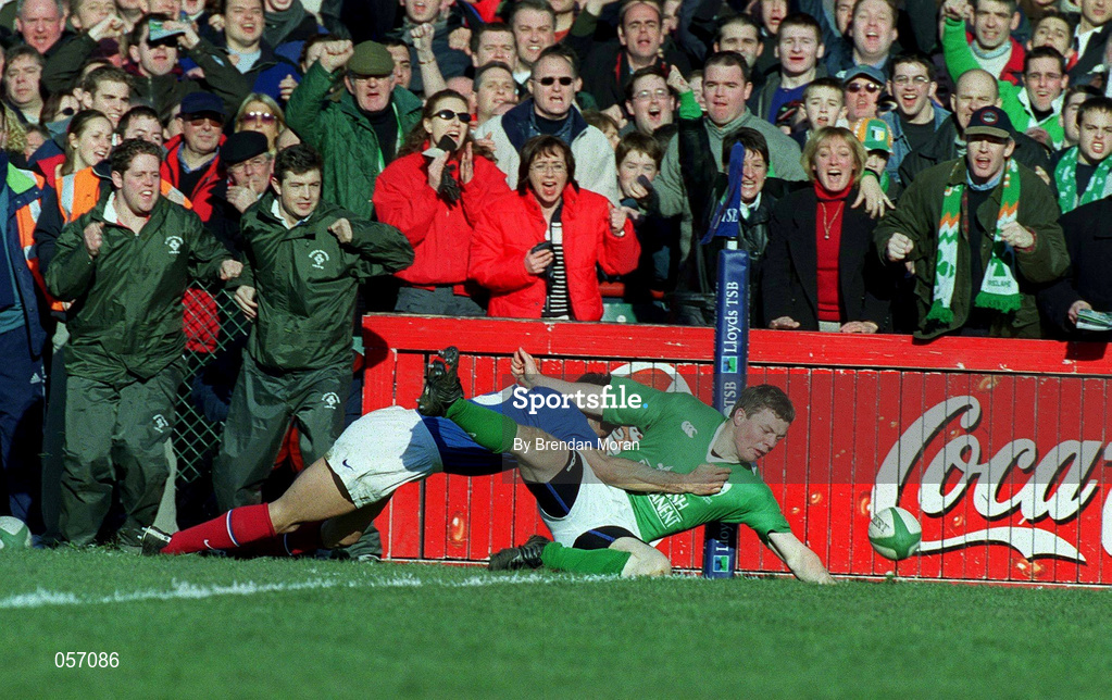 17 February 2001; Ireland's Brian O'Driscoll touches down to score his side's try despite the tackle of France's Xavier Garbajosa during the Lloyds TSB Six Nations Rugby Championship match between Ireland and France at Lansdowne Road in Dublin. Photo by Brendan Moran/Sportsfile