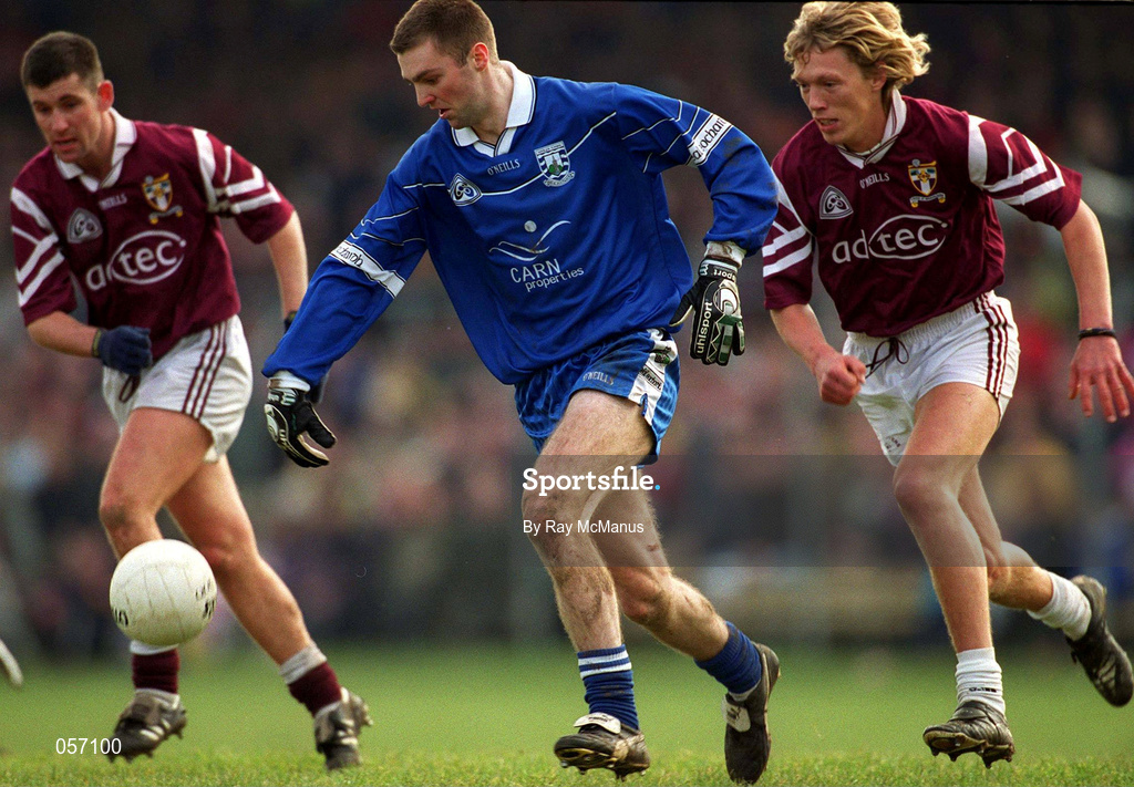 18 February 2001; Cathal Diamond of Bellaghy is tackled by Ciaran McDonald of Crossmolina during the AIB All-Ireland Senior Club Football Championship Semi-Final match between Crossmolina Deel Rovers and Bellaghy Wolfe Tones at Brewster Park in Enniskillen, Fermanagh. Photo by Ray McManus/Sportsfile
