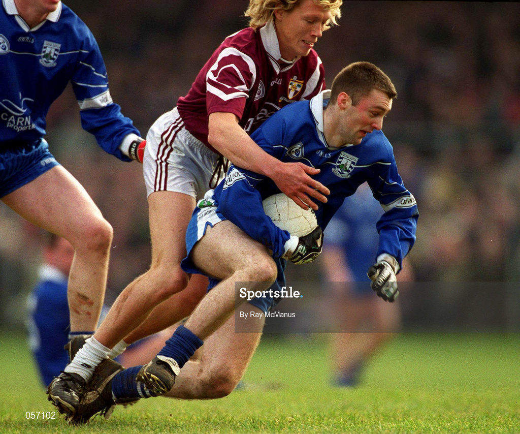 18 February 2001; Cathal Diamond of Bellaghy is tackled by Ciaran McDonald of Crossmolina during the AIB All-Ireland Senior Club Football Championship Semi-Final match between Crossmolina Deel Rovers and Bellaghy Wolfe Tones at Brewster Park in Enniskillen, Fermanagh. Photo by Ray McManus/Sportsfile