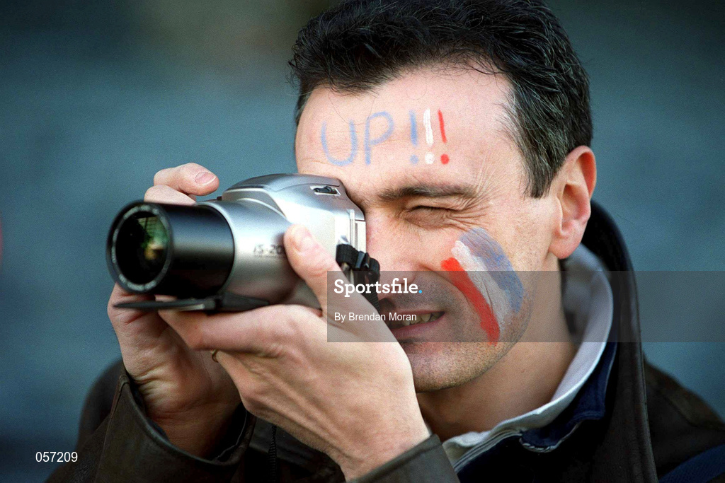 17 February 2001; A France supporter takes a photograph during the Lloyds TSB Six Nations Rugby Championship match between Ireland and France at Lansdowne Road in Dublin. Photo by Brendan Moran/Sportsfile