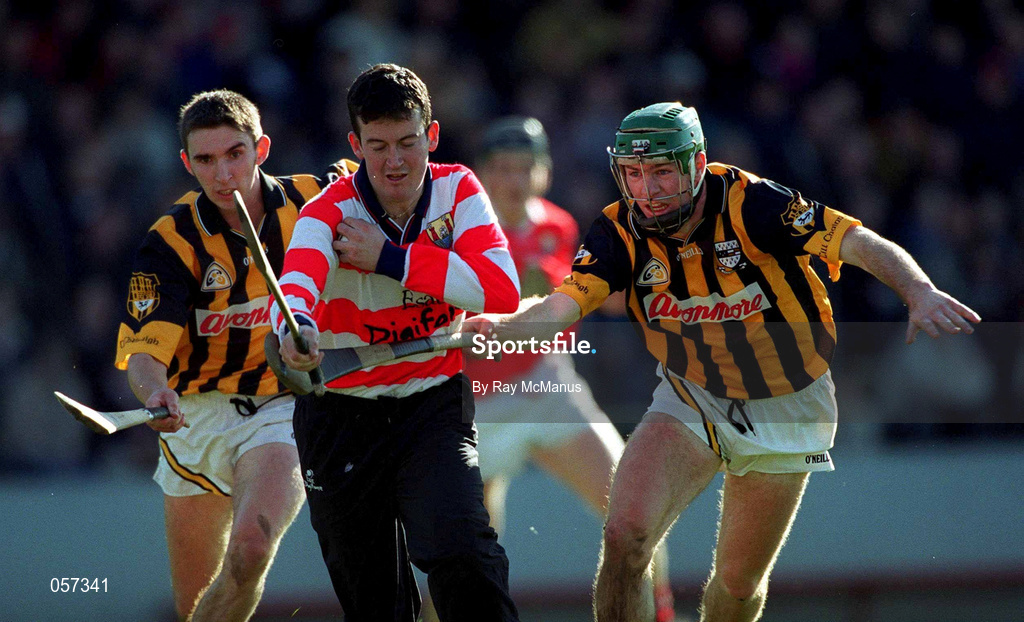 24 February 2001; Cork goalkeeper Dónal Óg Cusack is tackled by Kilkenny's Jimmy Coogan, right, and JP Corcoran during the Allianz National Hurling League Division 1B match between Cork and Kilkenny at Páirc Uí Chaoimh in Cork. Photo by Ray McManus/Sportsfile