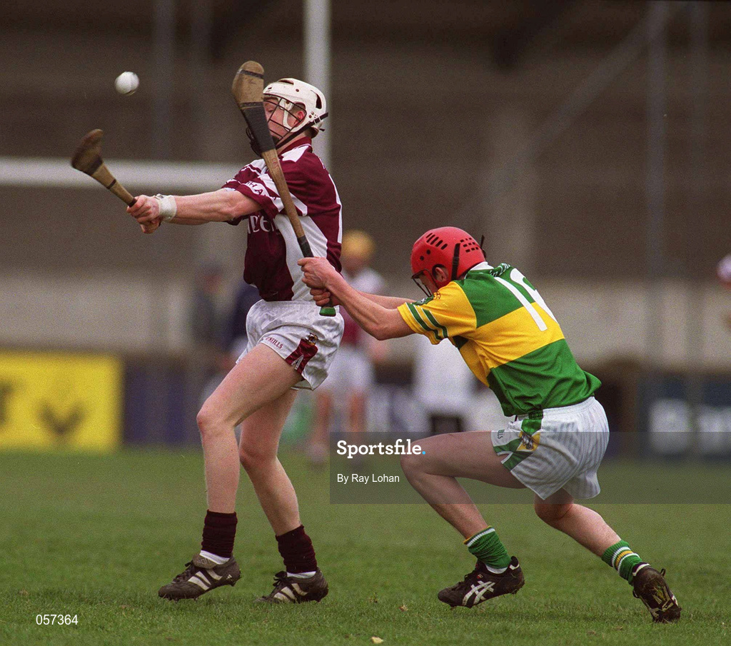 25 February 2001; Athenry's Diarmaid Burns in action against Martin Curry of Dunloy during the AIB All-Ireland Senior Club Hurling Championship Semi-Final match between Athenry and Dunloy at Parnell Park in Dublin. Photo by Ray Lohan/Sportsfile