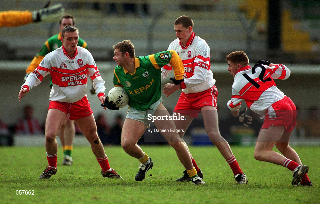25 February 2001; Cormac Murphy of Meath is tackled by Patrick Bradley and Conleth Gilligan of Derry during the Allianz National Football League Division 1B match between Meath and Derry at Páirc Tailteann in Navan, Meath. Photo by Damien Eagers/Sportsfile