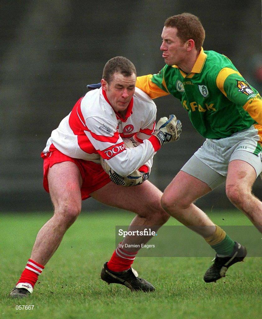 25 February 2001; Derry's Kevin McCloy is tackled by Donal Curtis of Meath during the Allianz National Football League Division 1B match between Meath and Derry at Páirc Tailteann in Navan, Meath. Photo by Damien Eagers/Sportsfile