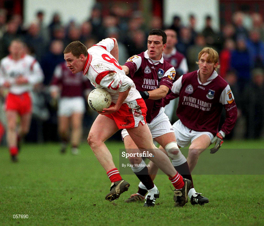 25 February 2001; Cormac McAnallen of Tyrone is tackled by Padraic Joyce of Galway during the Allianz National Football League Division 1A match between Galway and Tyrone at Duggan Park in Ballinasloe, Galway. Photo by Ray McManus/Sportsfile