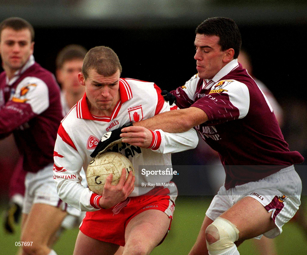 25 February 2001; Sean Teague of Tyrone is tackled by Padraic Joyce of Galway during the Allianz National Football League Division 1A match between Galway and Tyrone at Duggan Park in Ballinasloe, Galway. Photo by Ray McManus/Sportsfile