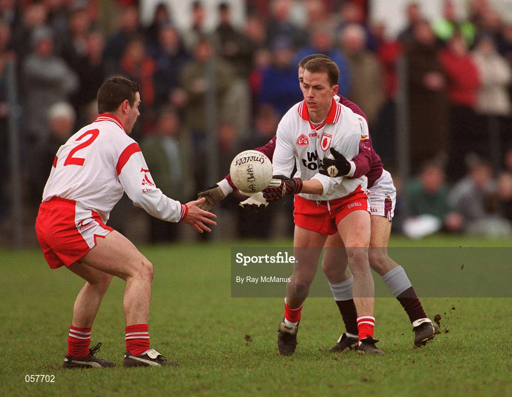 25 February 2001; Pascal Canavan offloads to his Tyrone team-mate Michael McGee during the Allianz National Football League Division 1A match between Galway and Tyrone at Duggan Park in Ballinasloe, Galway. Photo by Ray McManus/Sportsfile