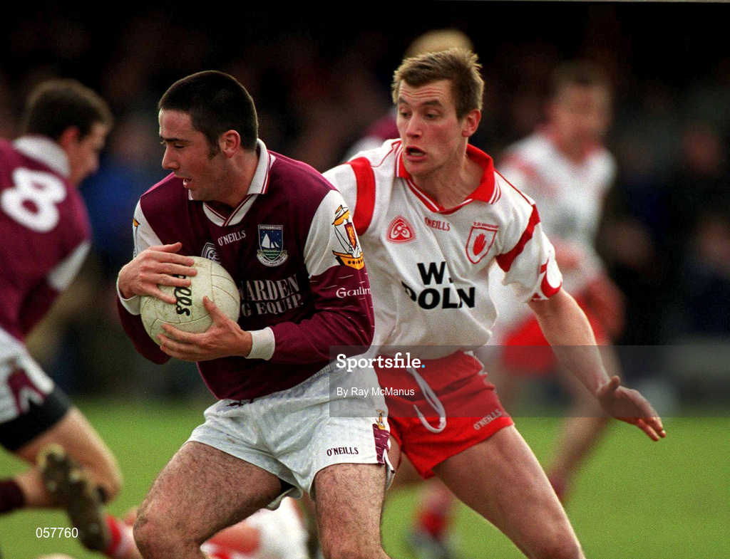 25 February 2001; Kieran Comer of Galway is tackled by Eoin Gormley of Tyrone during the Allianz National Football League Division 1A match between Galway and Tyrone at Duggan Park in Ballinasloe, Galway. Photo by Ray McManus/Sportsfile