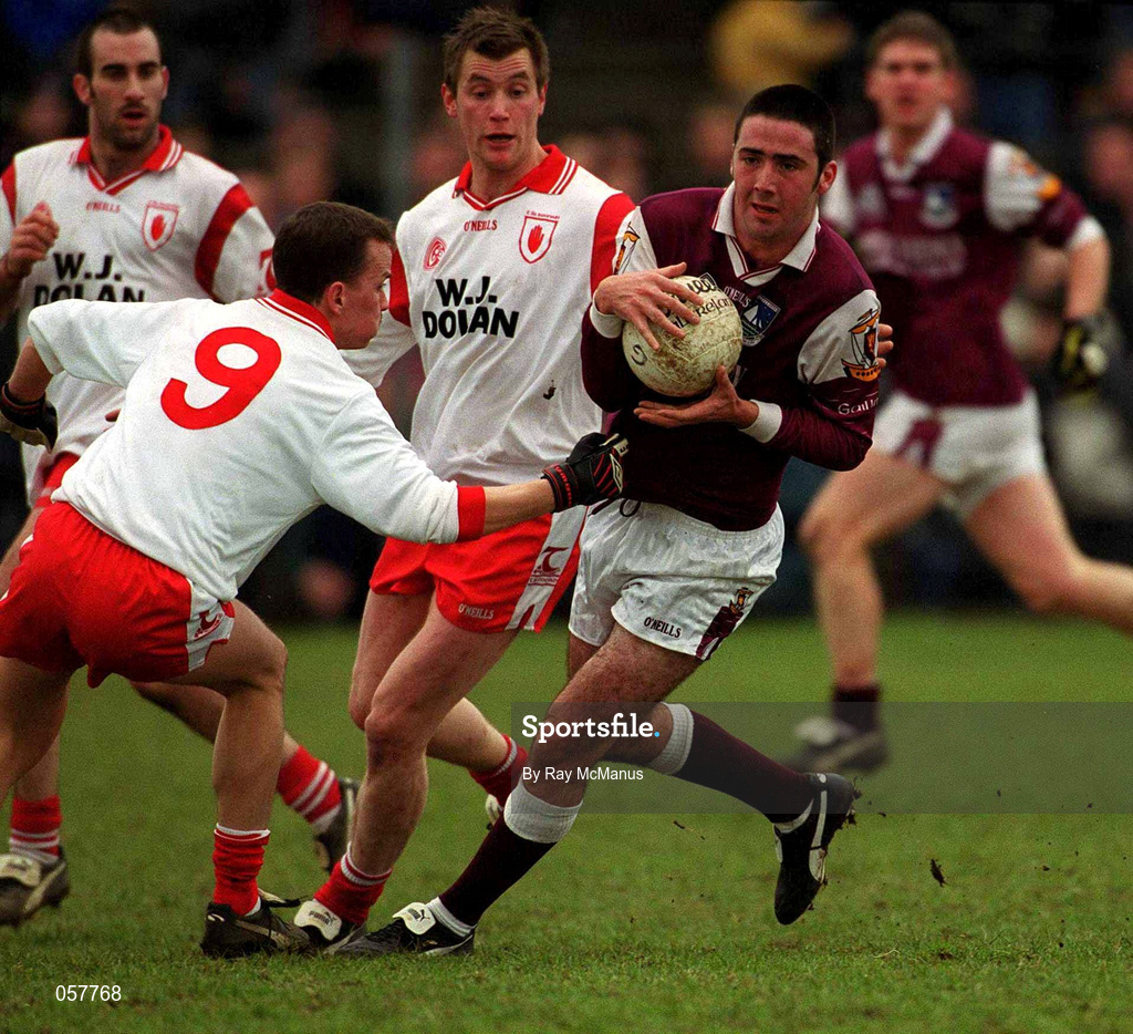 25 February 2001; Kieran Comer of Galway in action against Pascal Canavan, 9, of Tyrone during the Allianz National Football League Division 1A match between Galway and Tyrone at Duggan Park in Ballinasloe, Galway. Photo by Ray McManus/Sportsfile