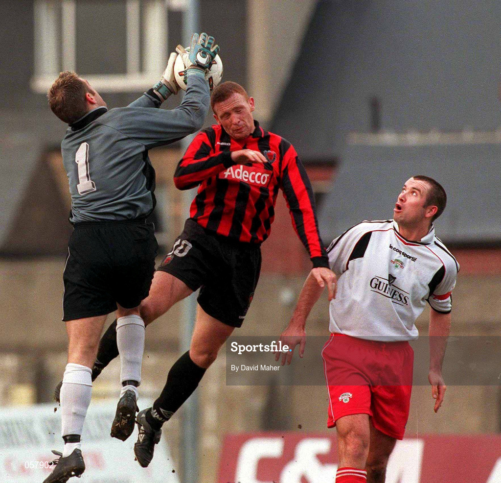 25 February 2001; Cork City goalkeeper Michael Devine in action against Glen Crowe of Bohemians during the Eircom League Premier Division match between Bohemians and Cork City at Dalymount Park in Dublin. Photo by David Maher/Sportsfile