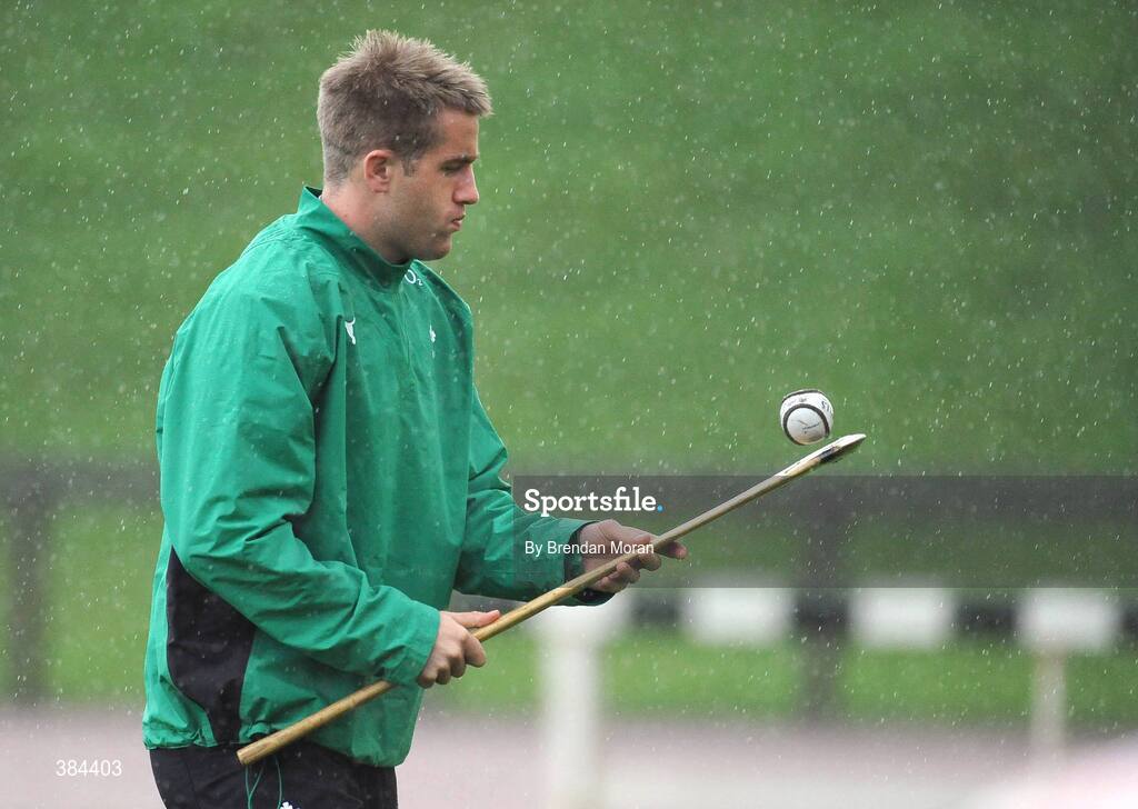 4 November 2009; Wing Luke Fitzgerald plays with a hurley and sliothar during Ireland rugby squad training. University of Limerick, Limerick. Picture credit: Brendan Moran / SPORTSFILE