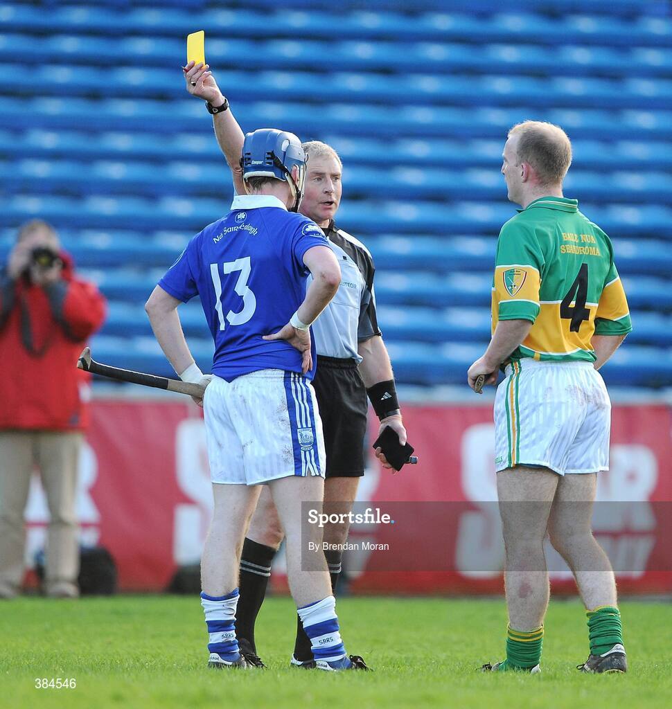 1 November 2009; Referee Ger Hoey shows a yellow card to Ritchie Ryan, 13, Thurles Sarsfields, and Dermot Gleeson, Newtownshandrum. AIB GAA Hurling Munster Senior Club Championship Quarter-Final, Thurles Sarsfields v Newtownshandrum, Semple Stadium, Thurles, Co. Tipperary. Picture credit: Brendan Moran / SPORTSFILE