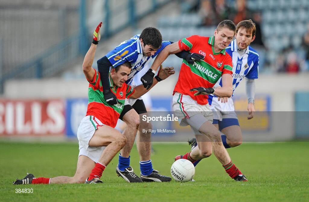 8 November 2009; Ballyboden St. Enda's players Michael McAuley, left, and Daniel Davey, 11,  in action against Nicholas Mernagh, left, and Stephen Kavanagh, Rathnew. AIB GAA Football Leinster Senior Club Championship Quarter-Final, Ballyboden St. Enda's v Rathnew, Parnell Park, Dublin. Picture credit: Ray McManus / SPORTSFILE