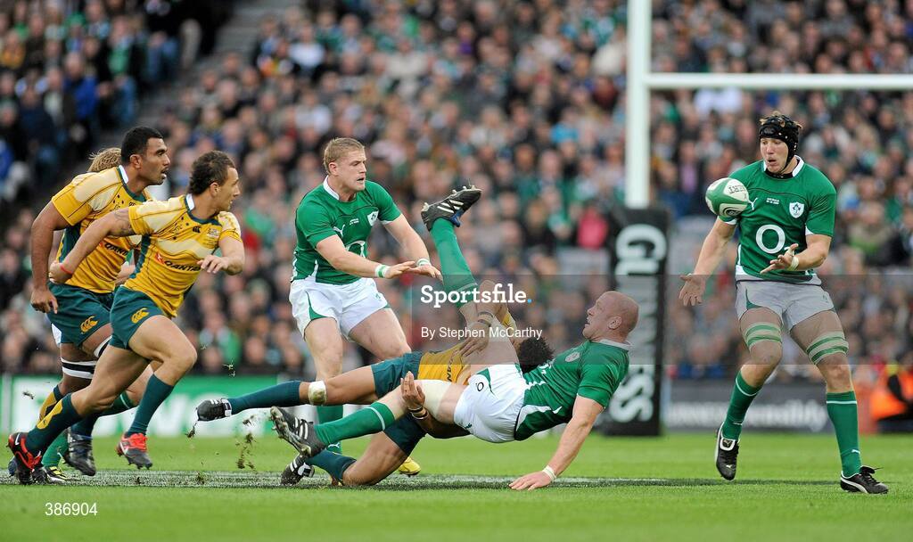 15 November 2009; Paul O'Connell, Ireland, is tackled by Digby Ioane, Australia, as he offloads the ball to team-mate Stephen Ferris, right. Autumn International Guinness Series 2009, Ireland v Australia, Croke Park, Dublin. Picture credit: Stephen McCarthy / SPORTSFILE