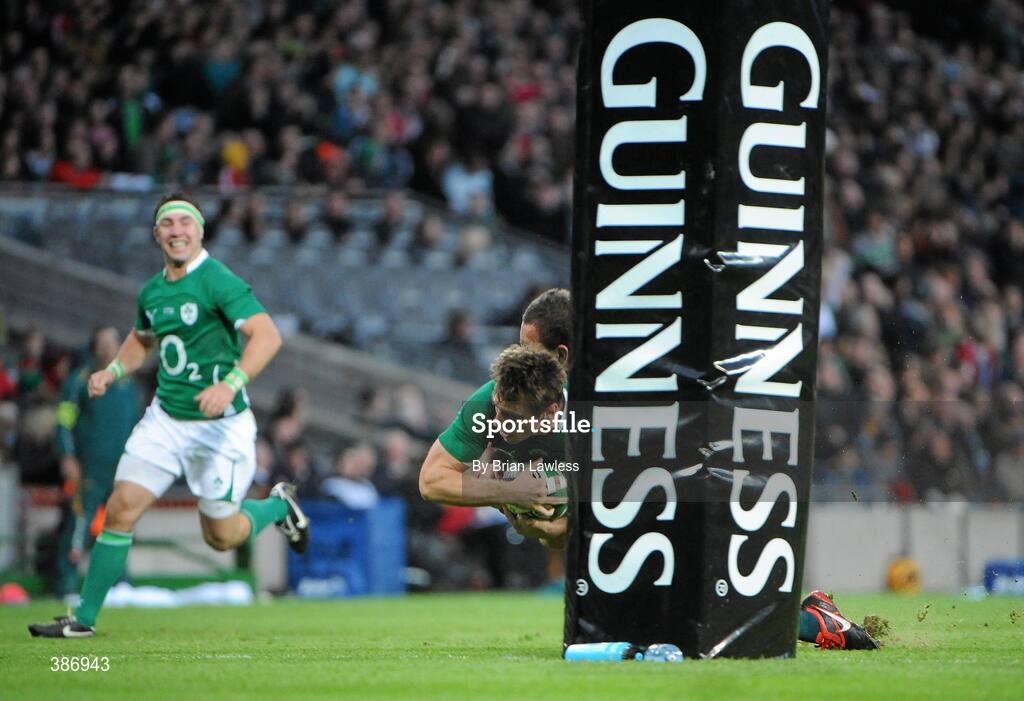 15 November 2009; Tommy Bowe, Ireland, goes over for his side's first try despite the attentions of 12, Australia. Autumn International Guinness Series 2009, Ireland v Australia, Croke Park, Dublin. Picture credit: Brian Lawless / SPORTSFILE