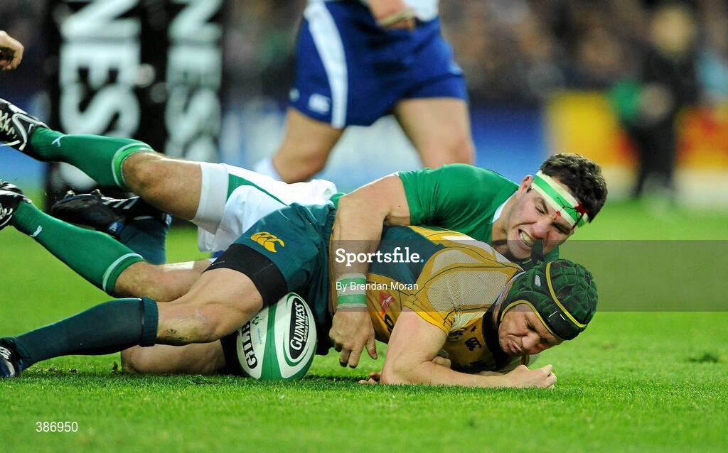 15 November 2009; Matt Giteau, Australia, is tackled by Paddy Wallace, Ireland. Autumn International Guinness Series 2009, Ireland v Australia, Croke Park, Dublin. Picture credit: Brendan Moran / SPORTSFILE