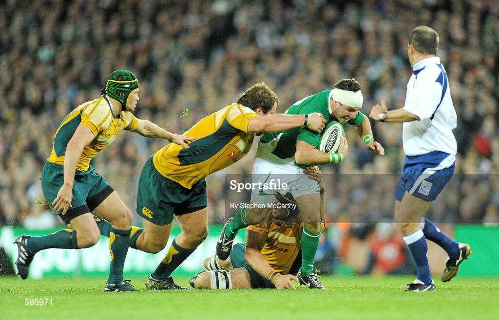 15 November 2009; Paddy Wallace, Ireland, is tackled by Matt Giteau, left, Ben Alexander and Mark Chisholm, right, Australia. Autumn International Guinness Series 2009, Ireland v Australia, Croke Park, Dublin. Picture credit: Stephen McCarthy / SPORTSFILE