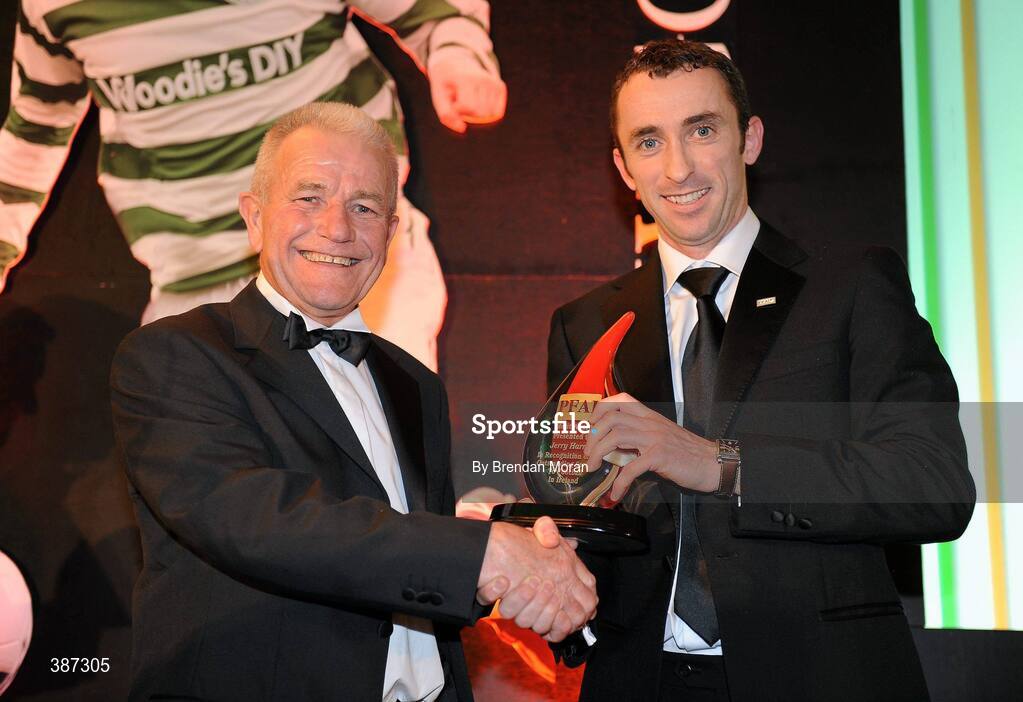 15 November 2009; Jerry Harris, left, Cork City FC, is presented with the Special Merit Award by Ollie Cahill, Professional Footballers Association of Ireland. PFAI Ford Awards 2009, The Burlington Hotel, Dublin. Picture credit: Brendan Moran / SPORTSFILE