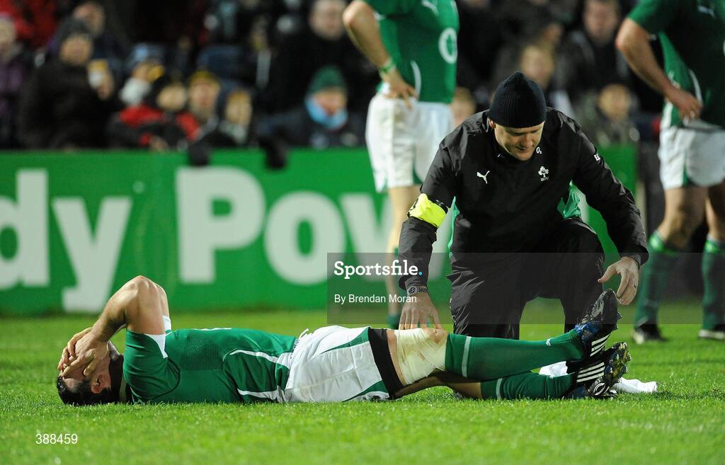 21 November 2009; Ireland's Denis Leamy lies on the ground with a suspected leg injury as he is attended to by Irish team doctor, Dr Eanna Falvey. Autumn International Guinness Series 2009, Ireland v Fiji, Royal Dublin Society, Ballsbridge, Dublin. Picture credit: Brendan Moran / SPORTSFILE