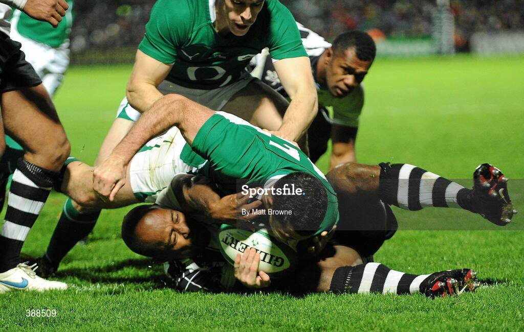 21 November 2009; Rob Kearney,  Ireland, goes over for his try against Fiji despite the tackle of Mosese Rauluni. Autumn International Guinness Series 2009, Ireland v Fiji, Royal Dublin Society, Ballsbridge, Dublin. Picture credit: Matt Browne / SPORTSFILE