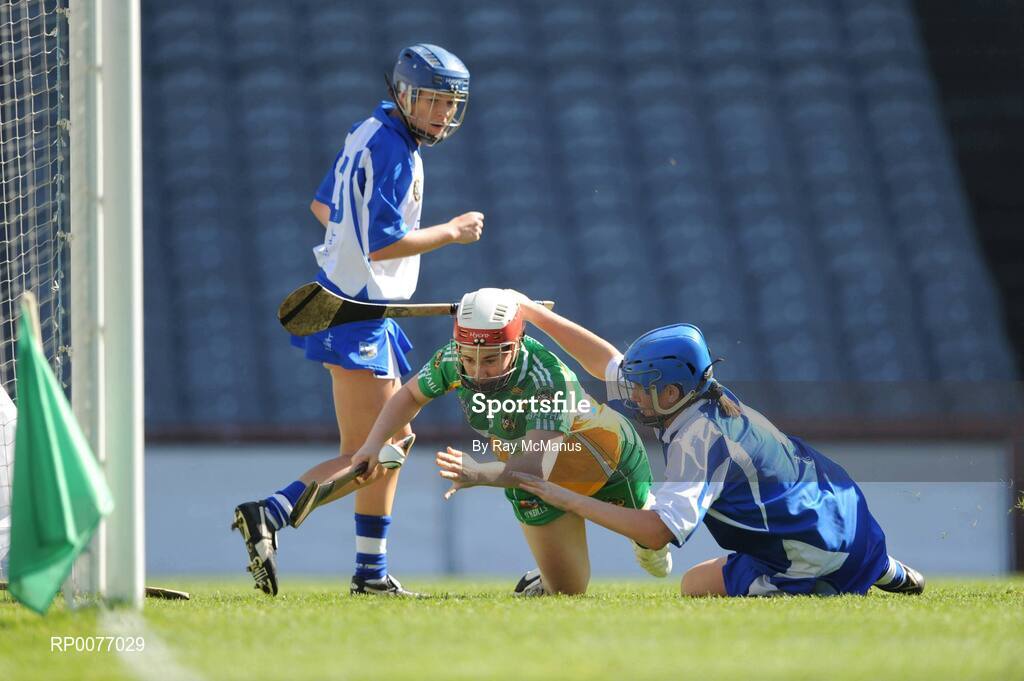 13 September 2009; Siobhán Flannery, Offaly, is taken down, in the square, by Waterford goalkeeper Ashling O'Brien who is assisted by full-back Sally O'Grady, Gala All-Ireland Junior Camogie Championship Final, Offaly v Waterford, Croke Park, Dublin. Picture credit: Ray McManus / SPORTSFILE