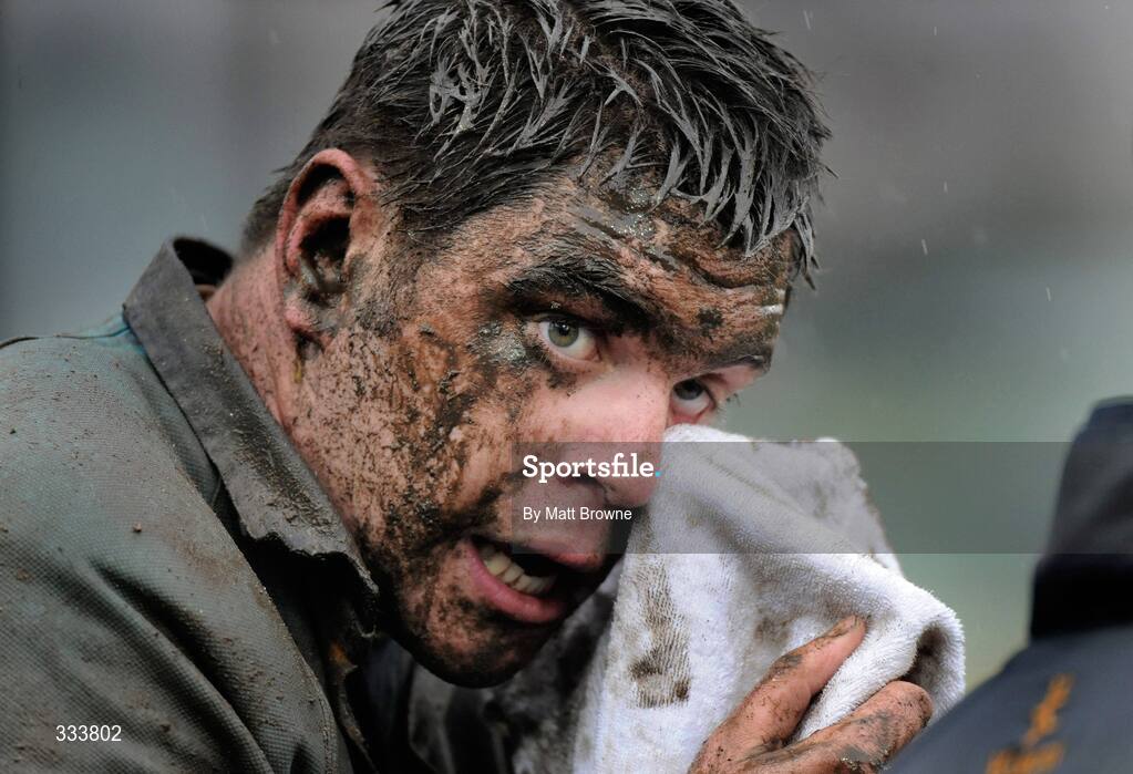 17 January 2009; Brian Cawley, UCD, wipes mud from his eyes during the game. AIB League Division 1, Clontarf v UCD, Castle Avenue, Clontarf, Dublin. Picture credit: Matt Browne / SPORTSFILE