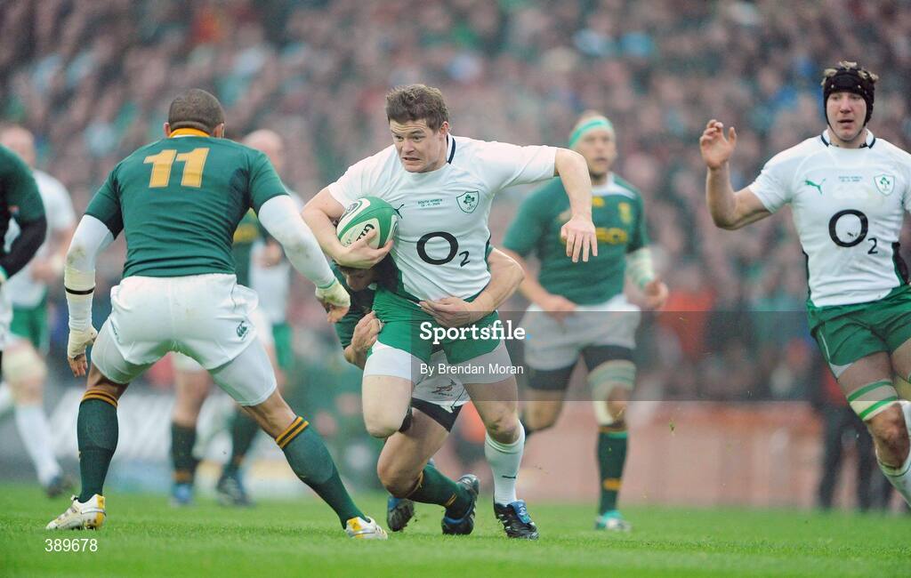 28 November 2009; Brian O'Driscoll, Ireland, is tackled by Zane Kirchner and Bryan Habana, 11, South Africa. Autumn International Guinness Series 2009, Ireland v South Africa, Croke Park, Dublin. Picture credit: Brendan Moran / SPORTSFILE