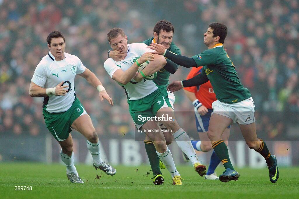 28 November 2009; Jamie Heaslip, Ireland, is tackled by Danie Rossouw and Jaque Fourie, South Africa. Autumn International Guinness Series 2009, Ireland v South Africa, Croke Park, Dublin. Picture credit: Brendan Moran / SPORTSFILE