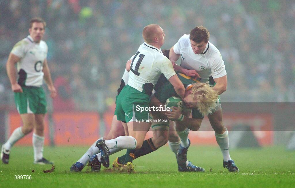 28 November 2009; Dewald Potgieter, South Africa, is tackled by Keith Earls, left, Cian Healy and Brian O'Driscoll, Ireland. Autumn International Guinness Series 2009, Ireland v South Africa, Croke Park, Dublin. Picture credit: Brendan Moran / SPORTSFILE