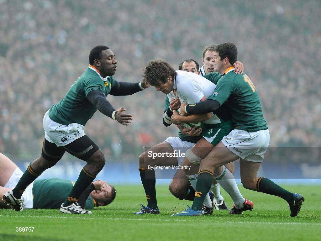 28 November 2009; Donncha O'Callaghan, Ireland, is tackled by South Africa players, from left, John Smit, Fourie du Preez and Marne Steyn. Autumn International Guinness Series 2009, Ireland v South Africa, Croke Park, Dublin. Picture credit: Stephen McCarthy / SPORTSFILE