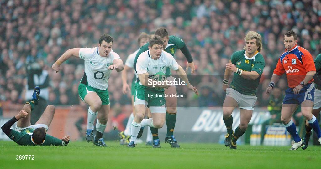 28 November 2009; Brian O'Driscoll, Ireland, supported by team-mate Cian Healy, breaks through the South African defence. Autumn International Guinness Series 2009, Ireland v South Africa, Croke Park, Dublin. Picture credit: Brendan Moran / SPORTSFILE