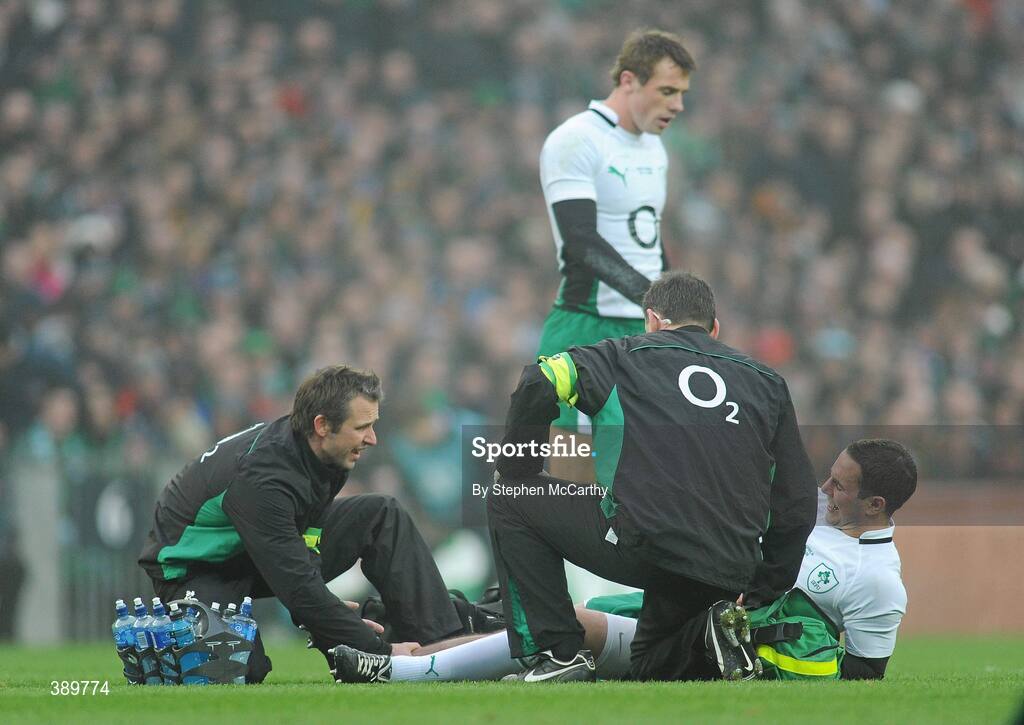 28 November 2009; Paddy Wallace, Ireland, is attended to by team physiotherapist Cameron Steele and Dr. Michael Webb, right. Autumn International Guinness Series 2009, Ireland v South Africa, Croke Park, Dublin. Picture credit: Stephen McCarthy / SPORTSFILE