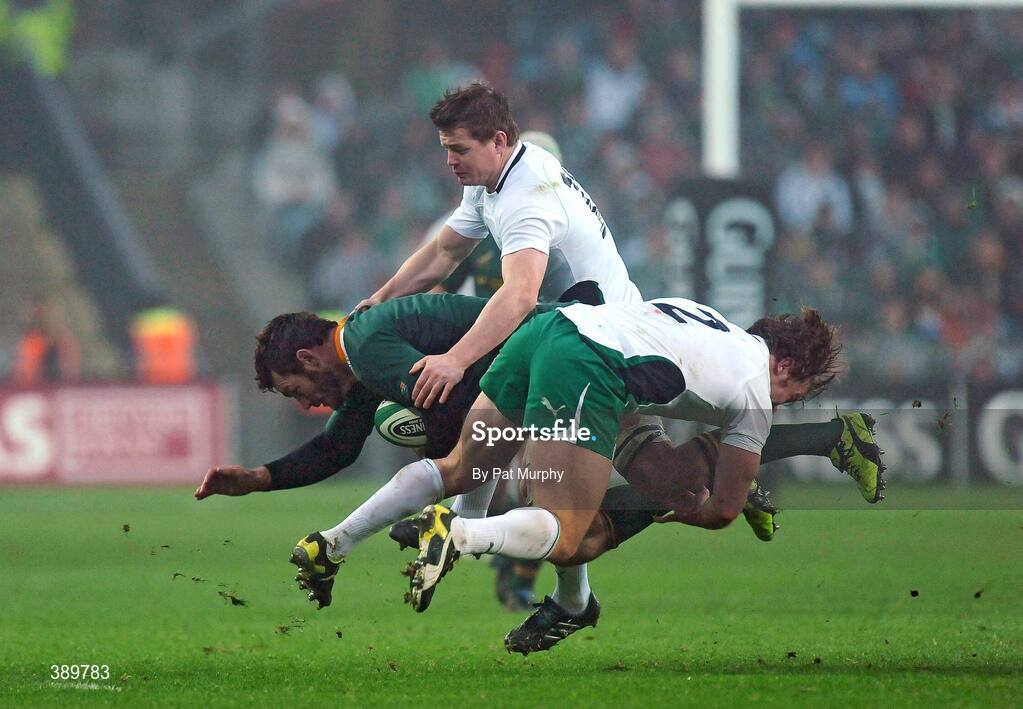 28 November 2009; Danie Rossouw, South Africa, is tackled by Jerry Flannery, 2, and Brian O'Driscoll, Ireland. Autumn International Guinness Series 2009, Ireland v South Africa, Croke Park, Dublin. Picture credit: Pat Murphy / SPORTSFILE
