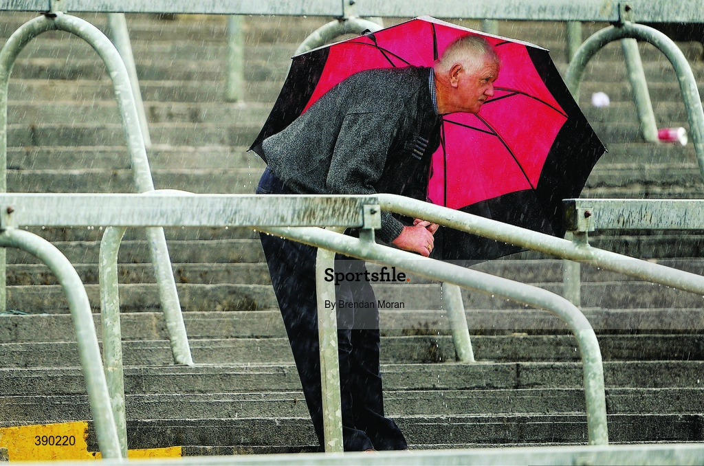 14 June 2009; Under my umbrella. Waterford and Limerick are serving up one of the worst hurling games of the summer in Semple Stadium. And it’s raining. Picture credit: Brendan Moran / SPORTSFILE       This image may be reproduced free of charge when used in conjunction with a review of the book "A Season of Sundays 2009". All other usage © SPORTSFILE