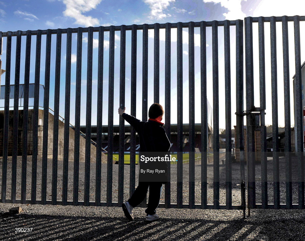 8 February 2009;Open up those gates. Kilkenny are many miles away, snowbound. Their league game with Galway is deferred. Meanwhile, the sun is shining on Pearse Stadium in Salthill as eight-year-old Donal O’Shea from nearby Knocknacarra peers in. Picture credit: Ray Ryan / SPORTSFILE      This image may be reproduced free of charge when used in conjunction with a review of the book "A Season of Sundays 2009". All other usage © SPORTSFILE *** Local Caption ***