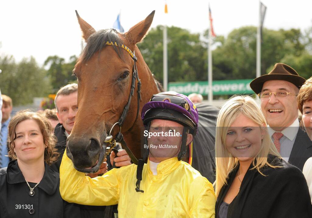 5 September 2009; Jockey Mick Kinane with winning connections and trainer John Oxx, right, after Sea The Stars had won the Tattersalls Millions Irish Champion Stakes. Leopardstown Racecourse, Dublin. Picture credit: Ray McManus / SPORTSFILE