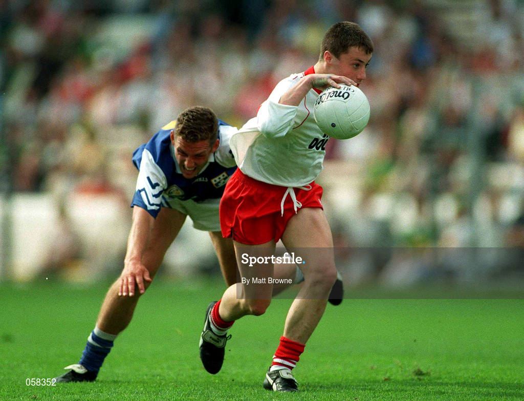27 September 1998; Brian McGuigan of Tyrone is tackled by Darren Rooney of Laois during the All-Ireland Minor Football Championship Final match between Laois and Tyrone at Croke Park in Dublin. Photo by Matt Browne/Sportsfile