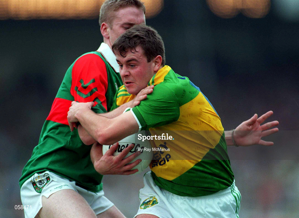 28 September 1997; Denis O'Dwyer of Kerry is tackled by David Heaney of Mayo during the Bank of Ireland All-Ireland Senior Football Championship Final between Kerry and Mayo at Croke Park in Dublin. Photo by Ray McManus/Sportsfile