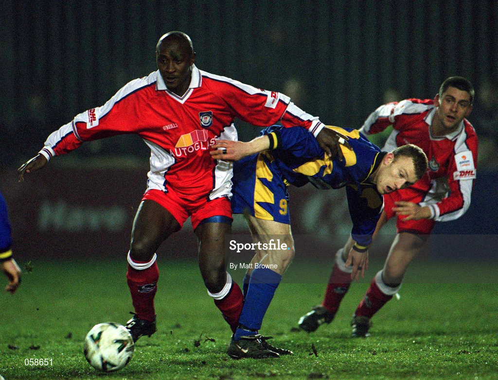 23 March 2001; Mbabazi Livingstone of St Patrick's Athletic in action against Keith O'Connor of Longford Town during the FAI Harp Lager Cup Third Round Replay match between St Patrick's Athletic and Longford Town at Richmond Park in Dublin. Photo by Matt Browne/Sportsfile