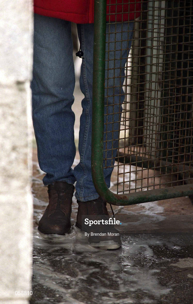 25 March 2001; A supporter walks over a disinfected mat, during the foot and mouth outbreak, on their way through the turnstile at the Offaly County Senior Hurling Championship Final match between Birr and Seir Kieran at St Brendan's Park in Birr, Offaly. Photo by Brendan Moran/Sportsfile