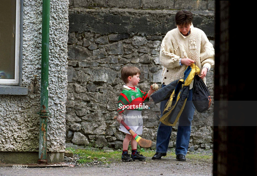 25 March 2001; Mascot Eoghan Cahill, age three, gets ready with his mother Bernie, to lead out the Birr team with his father Gary, who is the team captain, at the Offaly County Senior Hurling Championship Final match between Birr and Seir Kieran at St Brendan's Park in Birr, Offaly. Photo by Brendan Moran/Sportsfile