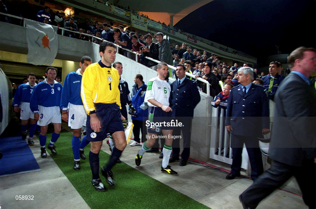 24 March 2001; Team captains Roy Keane of Republic of Ireland and Nikos Panayiotov of Cyprus lead their teams out before the 2002 FIFA World Cup Qualification Group 2 match between Cyprus and Republic of Ireland at GSP Stadium in Nicosia, Cyprus. Photo by Damien Eagers/Sportsfile