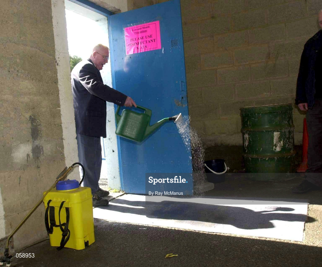 31 March 2001; "Kinger" Pat King, a member of the ground staff at Semple Stadium, sprays disinfectant on to a matt at an entrance in an effort to stop the spread of Foot and Mouth Disease before the AIB All-Ireland Senior Club Hurling Championship Semi-Final Replay match between Graigue Ballycallan and Sixmilebridge at Semple Stadium in Thurles, Tipperary. Photo by Ray McManus/Sportsfile