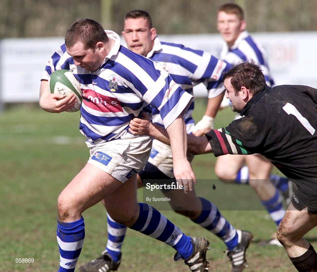 31 March 2001; Gary Leslie of Dungannon is tackled by Eddie Devitt of DLSP during the AIB All-Ireland League Division 1 match between Dungannon RFC and DLSP RFC at Stevenson Park in Dungannon, Tyrone. Photo by Sportsfile