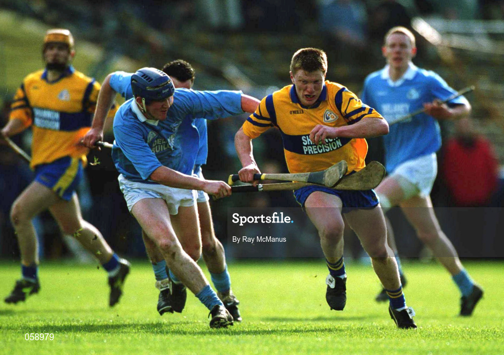 31 March 2001; Niall Gilligan of Sixmilebridge races past Paddy O'Dwyer of Graigue Ballycallan during the AIB All-Ireland Senior Club Hurling Championship Semi-Final Replay match between Graigue Ballycallan and Sixmilebridge at Semple Stadium in Thurles, Tipperary. Photo by Ray McManus/Sportsfile