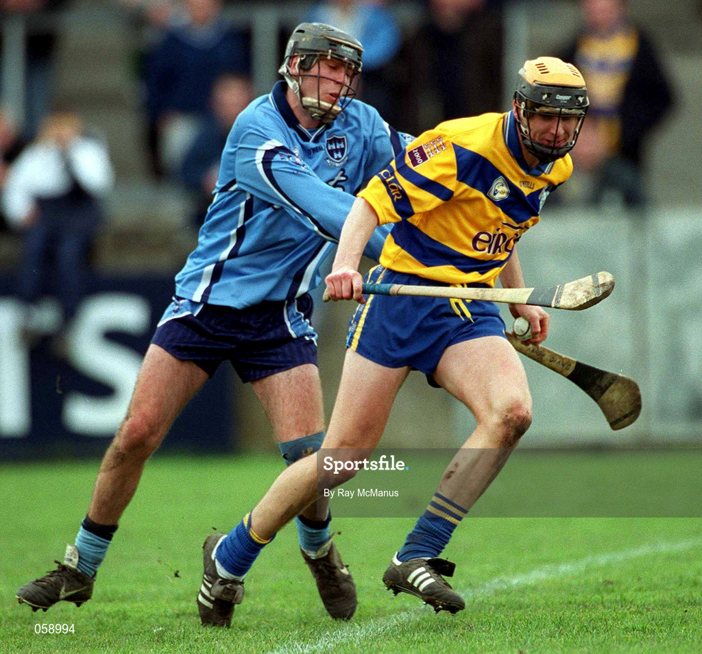 1 April 2001; Tony Griffin of Clare is tackled by David Henry of Dublin during the Allianz National Hurling League Division 1A match between Dublin and Clare at Parnell Park in Dublin. Photo by Ray McManus/Sportsfile