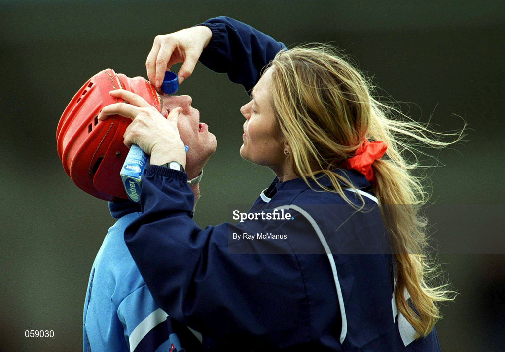 1 April 2001; Thomas Moore of Dublin has his eye washed by team physio Frankie Hennessy during the Allianz National Hurling League Division 1A match between Dublin and Clare at Parnell Park in Dublin. Photo by Ray McManus/Sportsfile